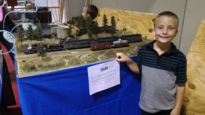 young boy with trainset