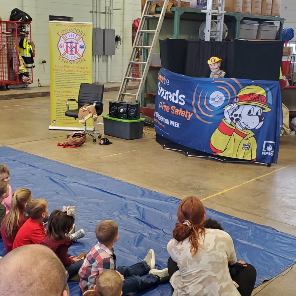 Families watching a puppet show