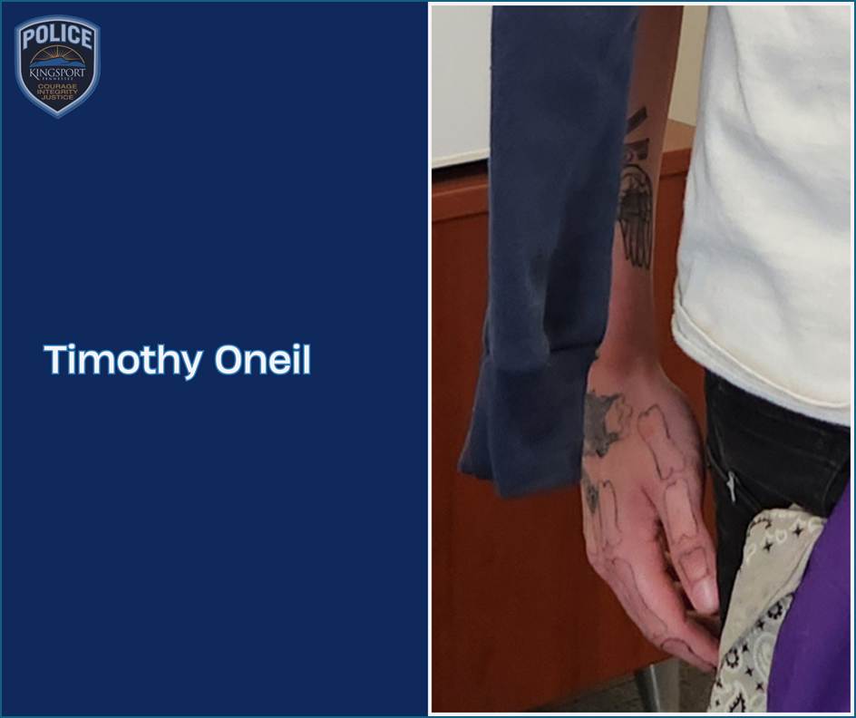 A recent photo of Timothy Oneil. (Close up of arm and hand tattoos)